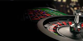 Filipino player enjoying fish shooting game on smartphone at okaok casino